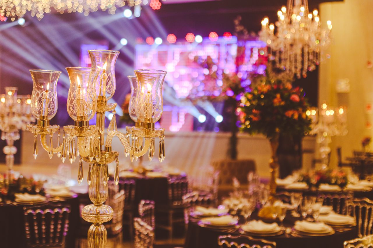 services-01 An elegant ballroom setup with crystal candelabras and luxurious decorations, perfect for a grand celebration.