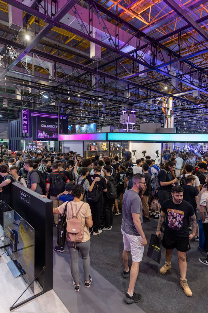 about-img A bustling crowd at a technology convention, showcasing vibrant energy and diverse attendees.