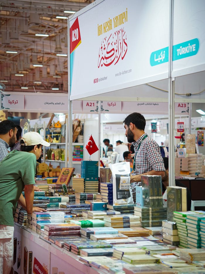 about-02 Vibrant scene from a book fair in Istanbul with customers exploring various titles.